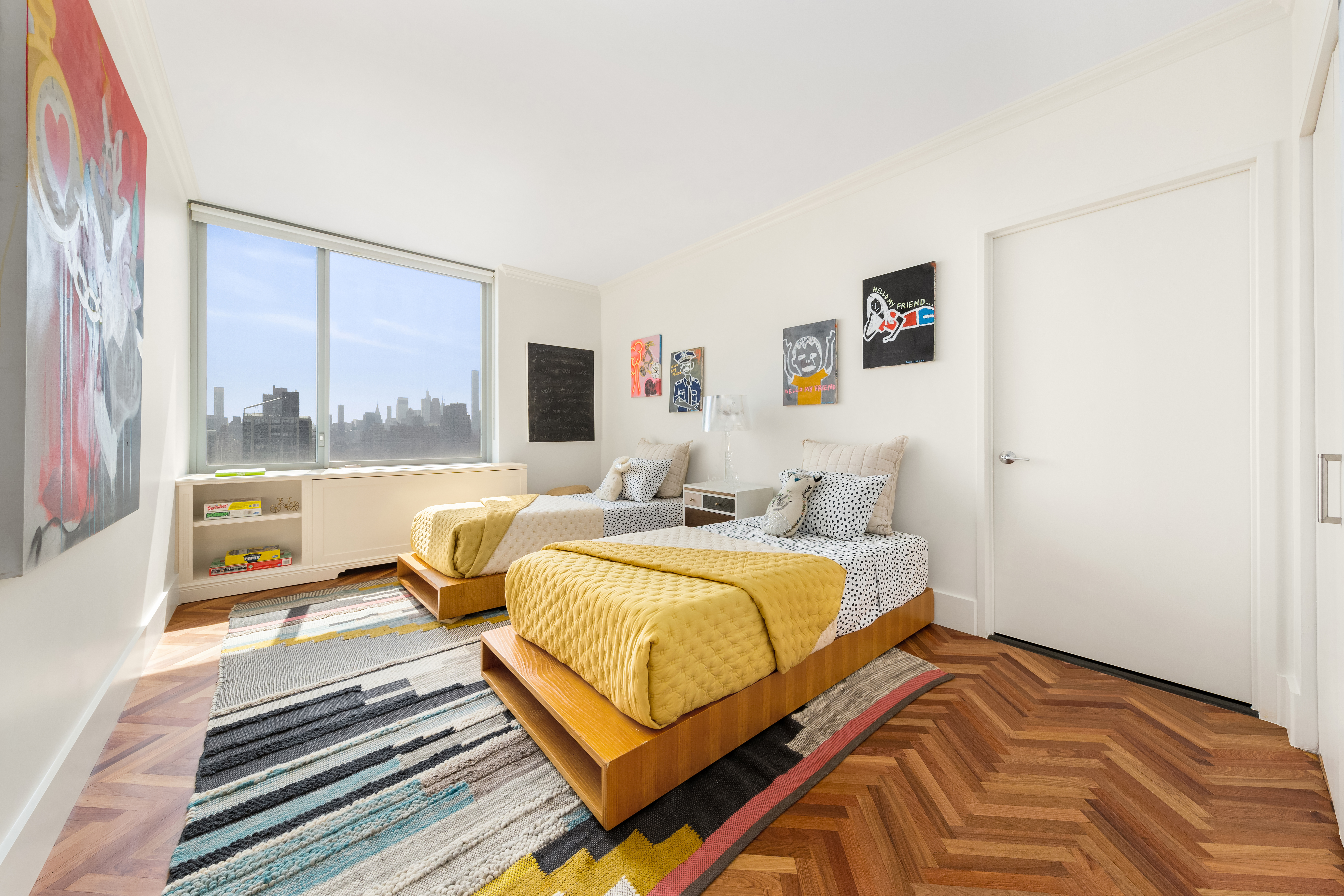 360 East 88th Street, Unit 31C Manhattan, NY 10128 - Photo 13 of 24 a bedroom with a bed and a large window