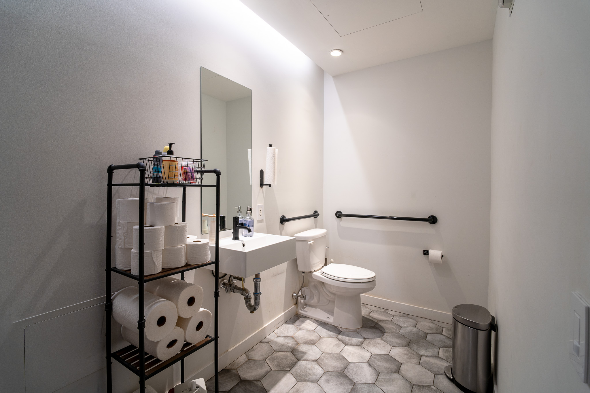 85 5th Avenue, Unit 8 Manhattan, NY 10003 - Photo 11 of 12 a bathroom with a toilet sink and mirror