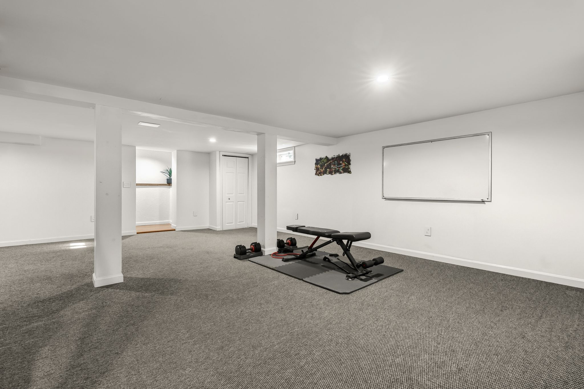 129 H J Albee Drive Braintree, MA 02184 - Photo 22 of 36 a view of a room with gym equipment and windows