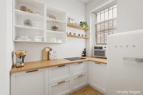 a kitchen with stainless steel appliances a sink and a refrigerator
