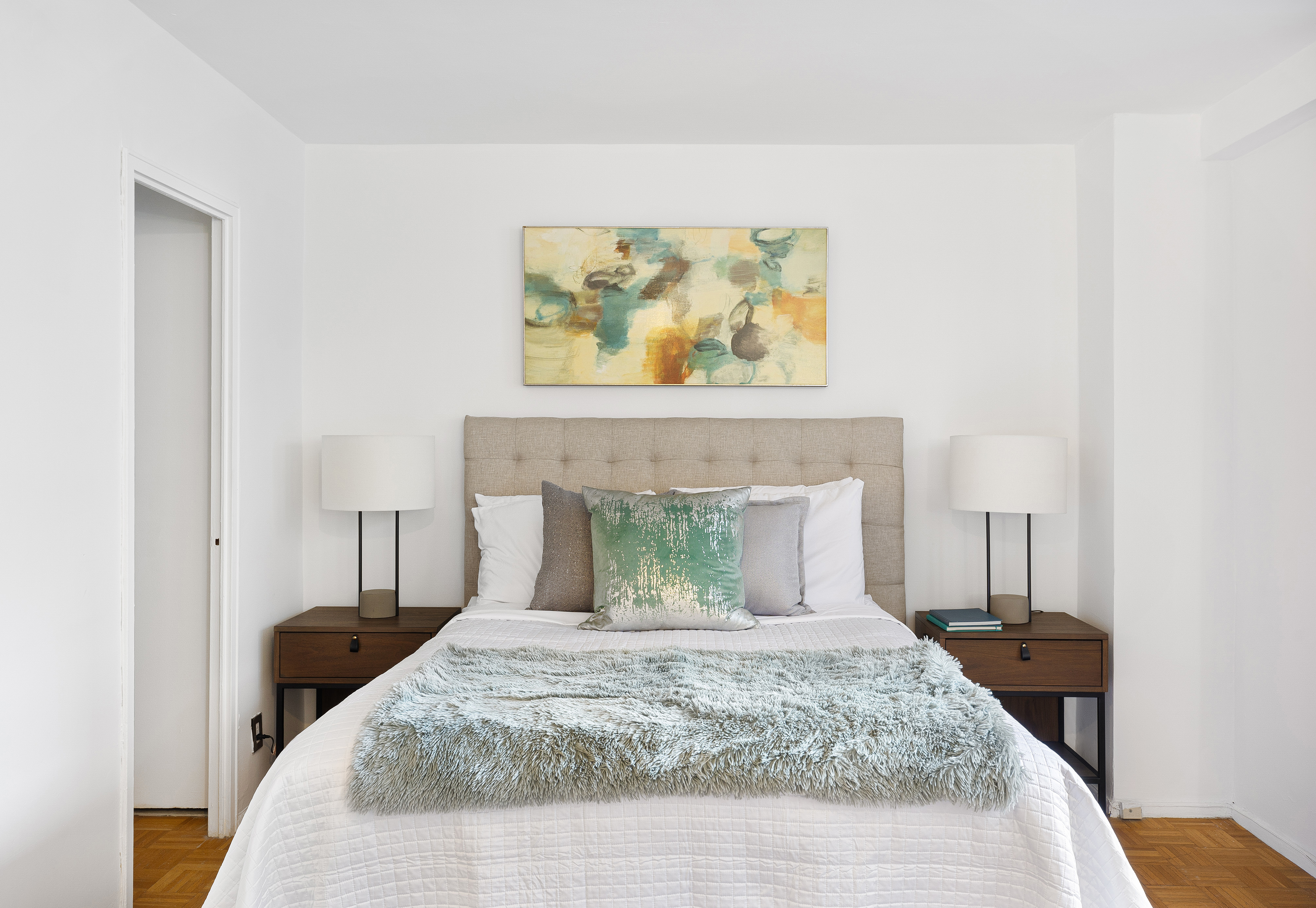 145 East 15th Street, Unit 7C Manhattan, NY 10003 - Photo 4 of 10 a bedroom with a bed and a painting on the wall