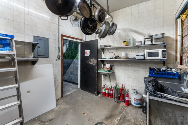 a kitchen with stainless steel appliances granite countertop a sink and a stove