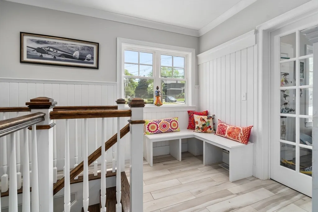 a room with lots of furniture and white walls