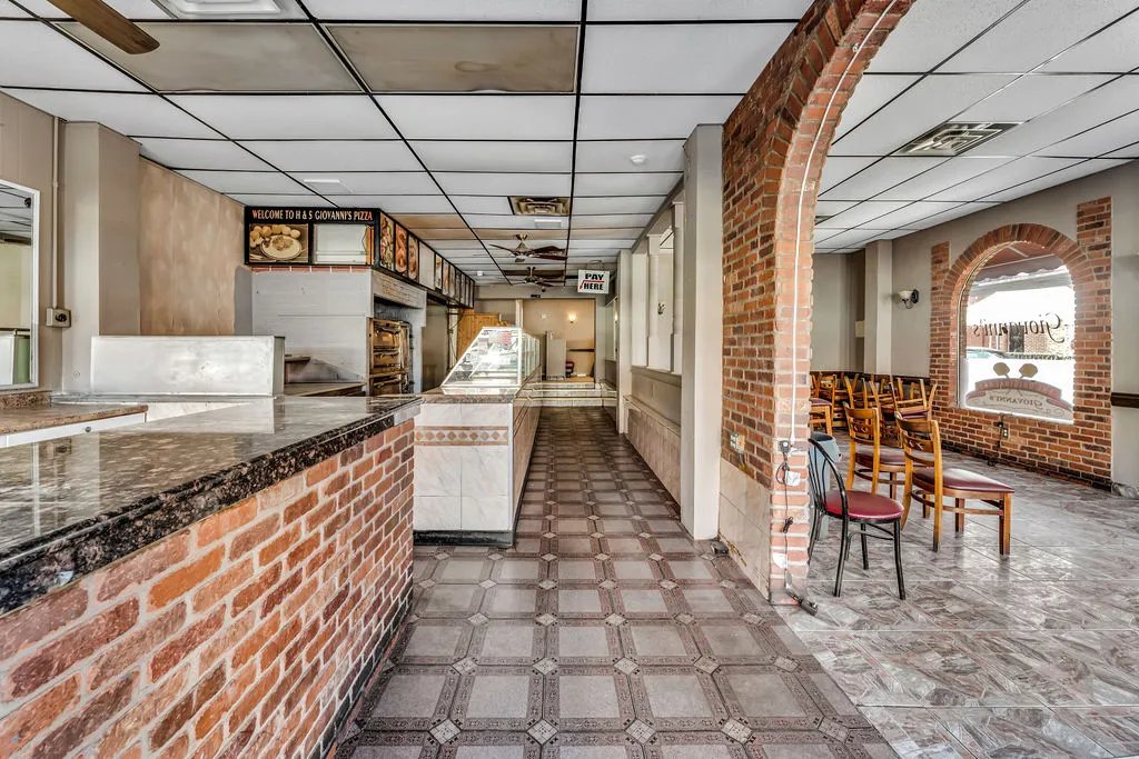 a view of a chairs and table in a patio