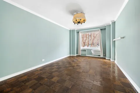 a view of an empty room and a window