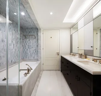 a bathroom with a bathtub and a sink