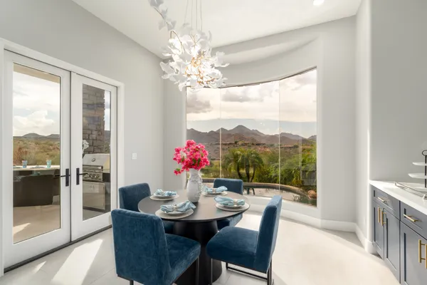 a living room with furniture a rug and white walls