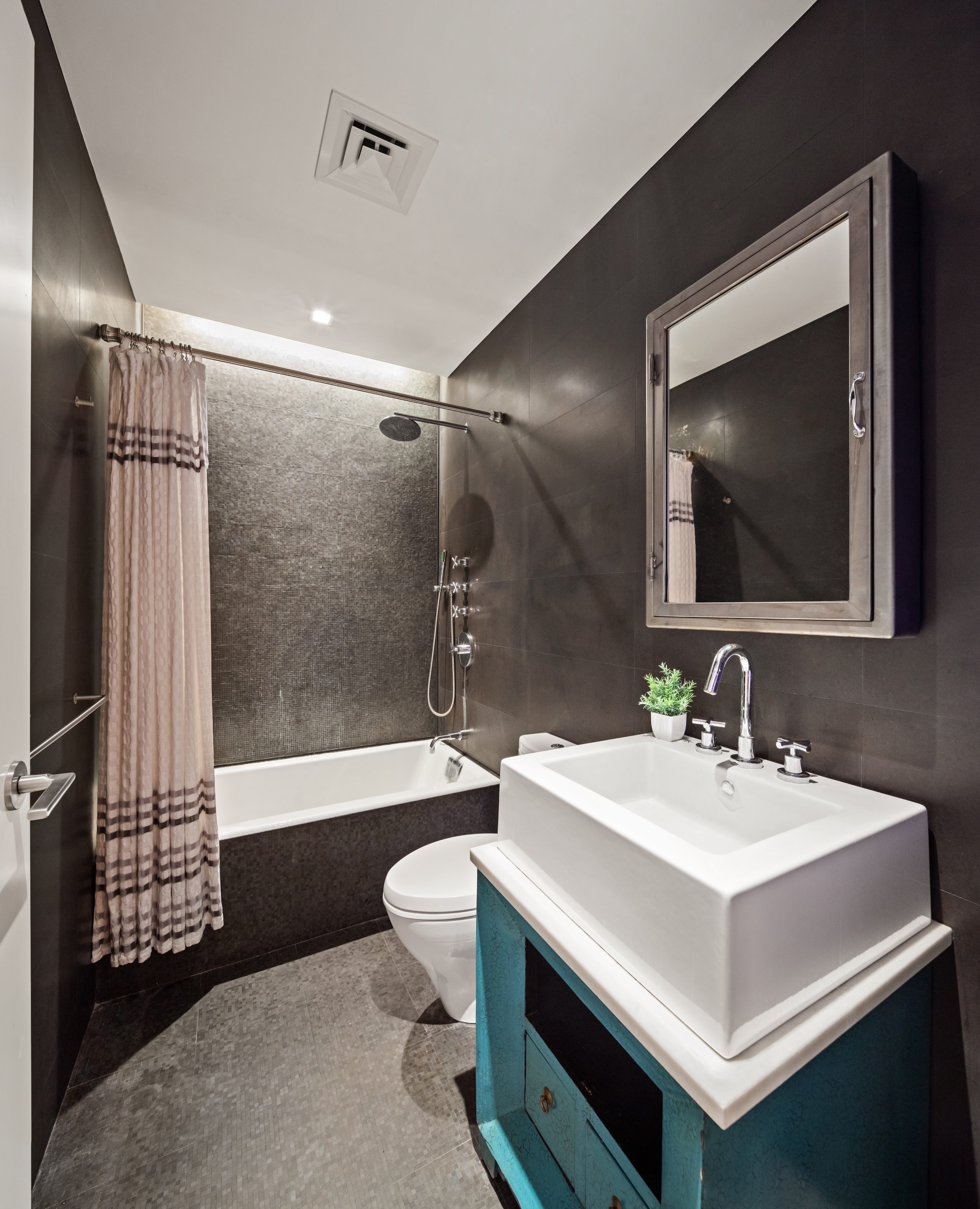 35 Spring Street Manhattan, NY 10012 - Photo 11 of 14 a bathroom with a sink toilet a mirror and bathtub