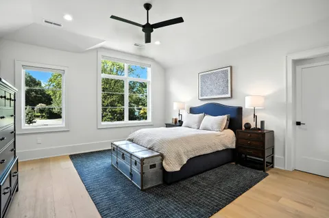 a view of backyard with seating area and green space