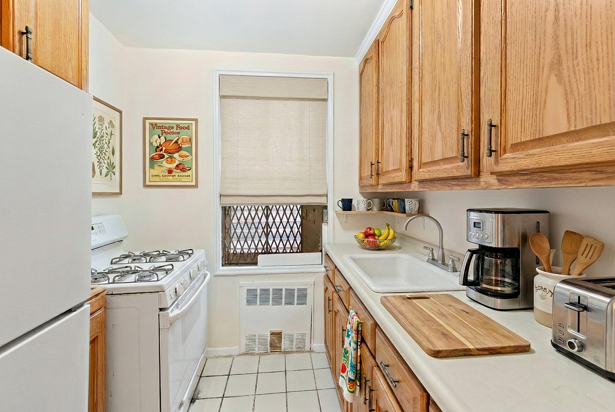 3210 Arlington Avenue, Unit 3D Bronx, NY 10463 - Photo 3 of 24 a kitchen with a refrigerator and a stove top oven