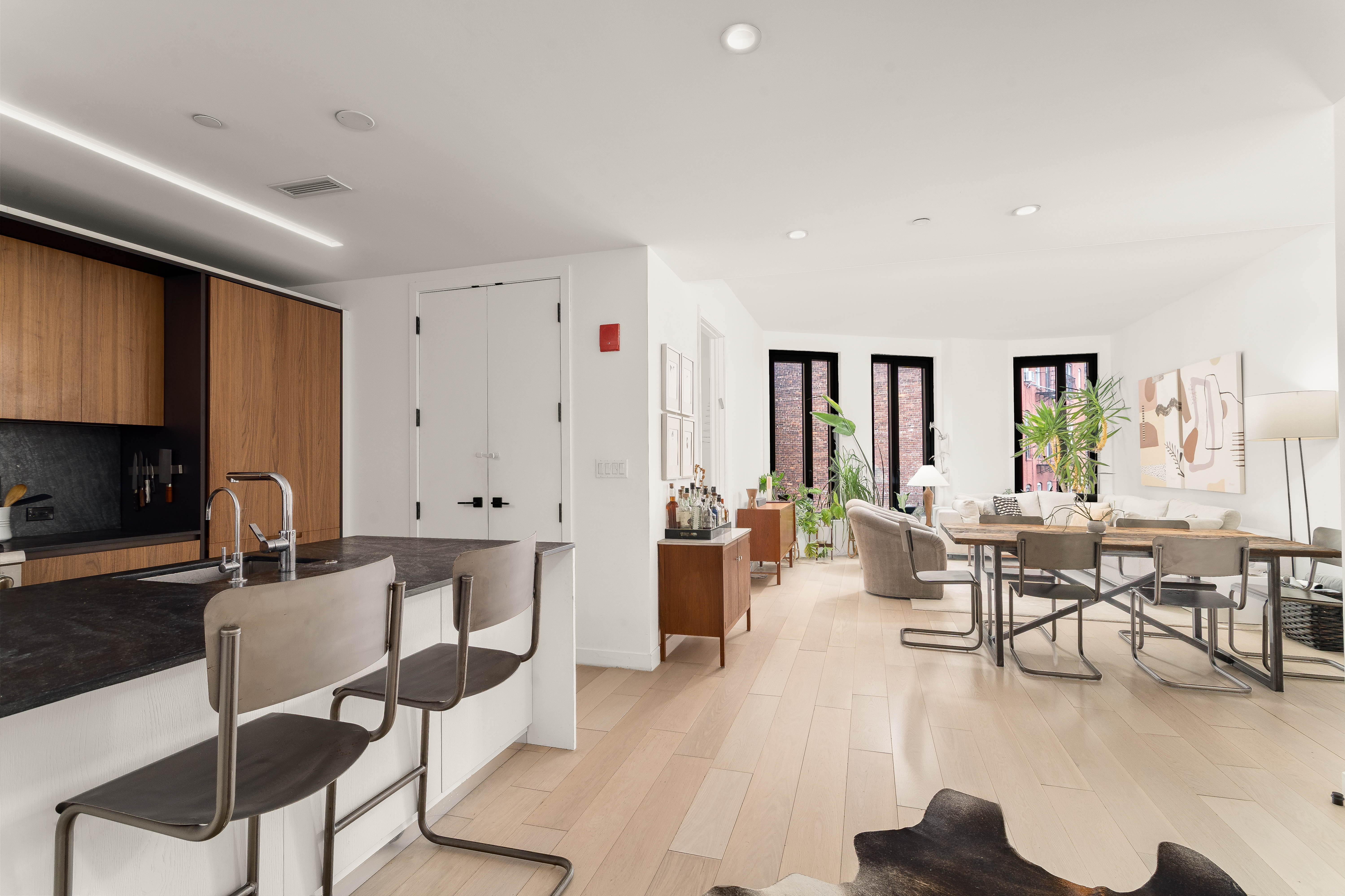 856 Washington Avenue, Unit 5A Brooklyn, NY 11238 - Photo 2 of 19 a living room with lots of furniture and view of kitchen