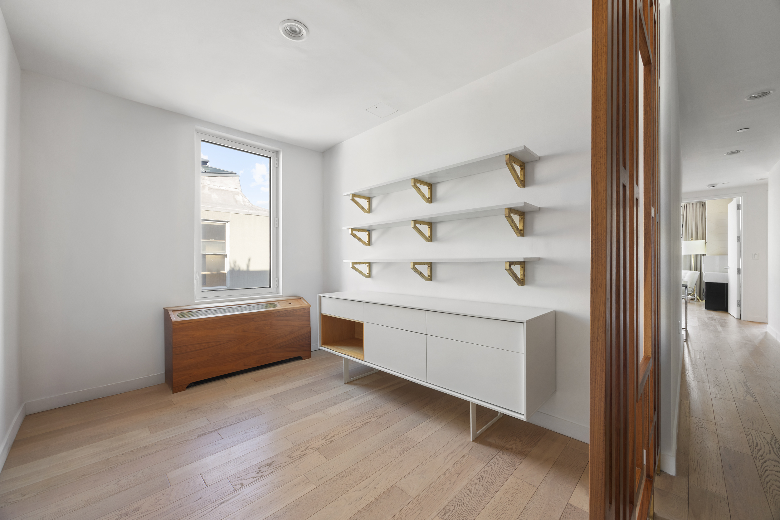 540 West 49th Street, Unit PH1N Manhattan, NY 10019 - Photo 8 of 18 a room with furniture and window