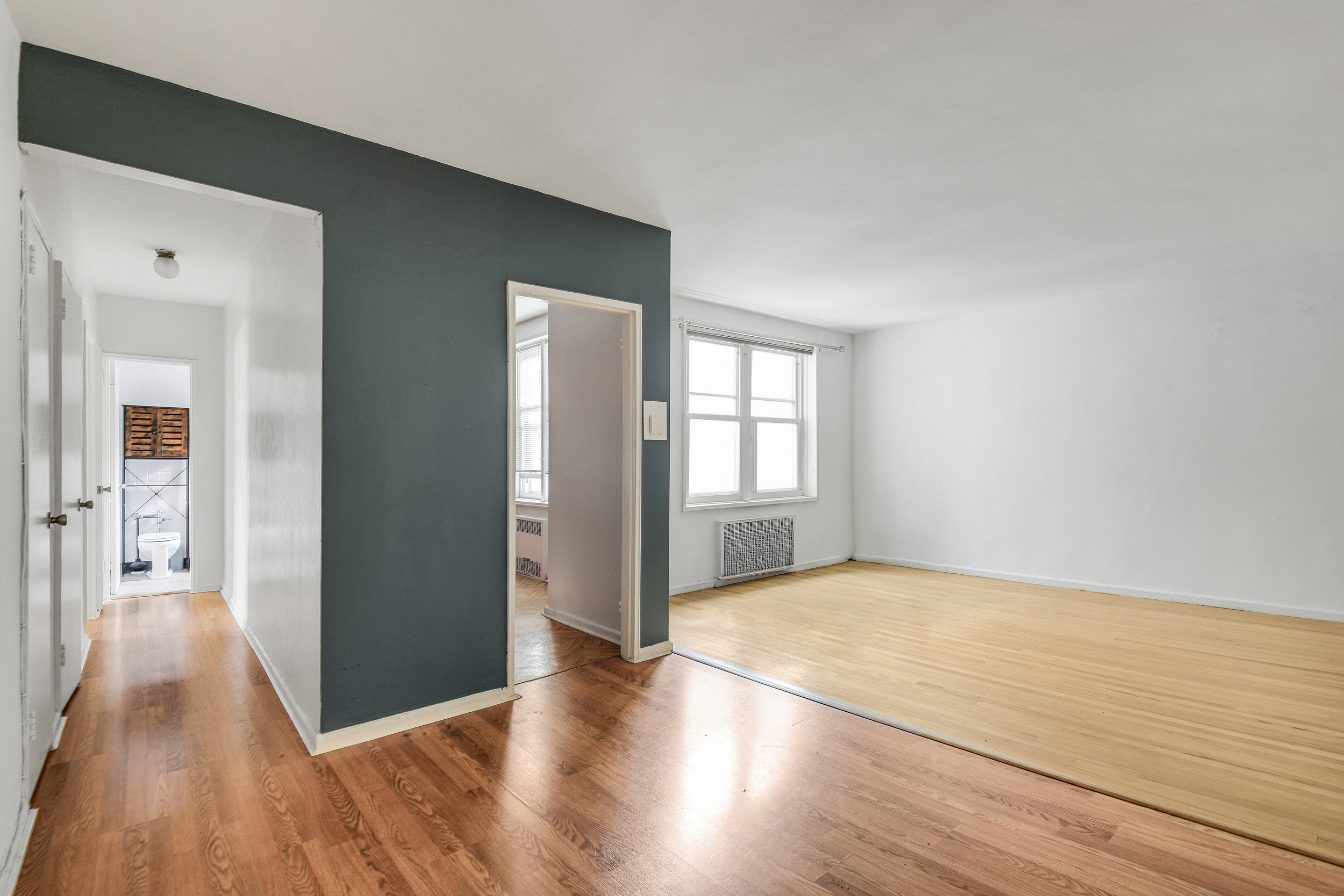 9801 Shore Road, Unit 4P Brooklyn, NY 11209 - Photo 4 of 13 a view of a livingroom with wooden floor