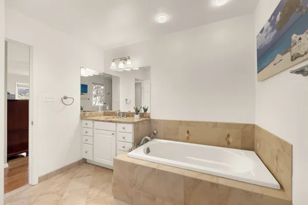 a bedroom with a bed and a table