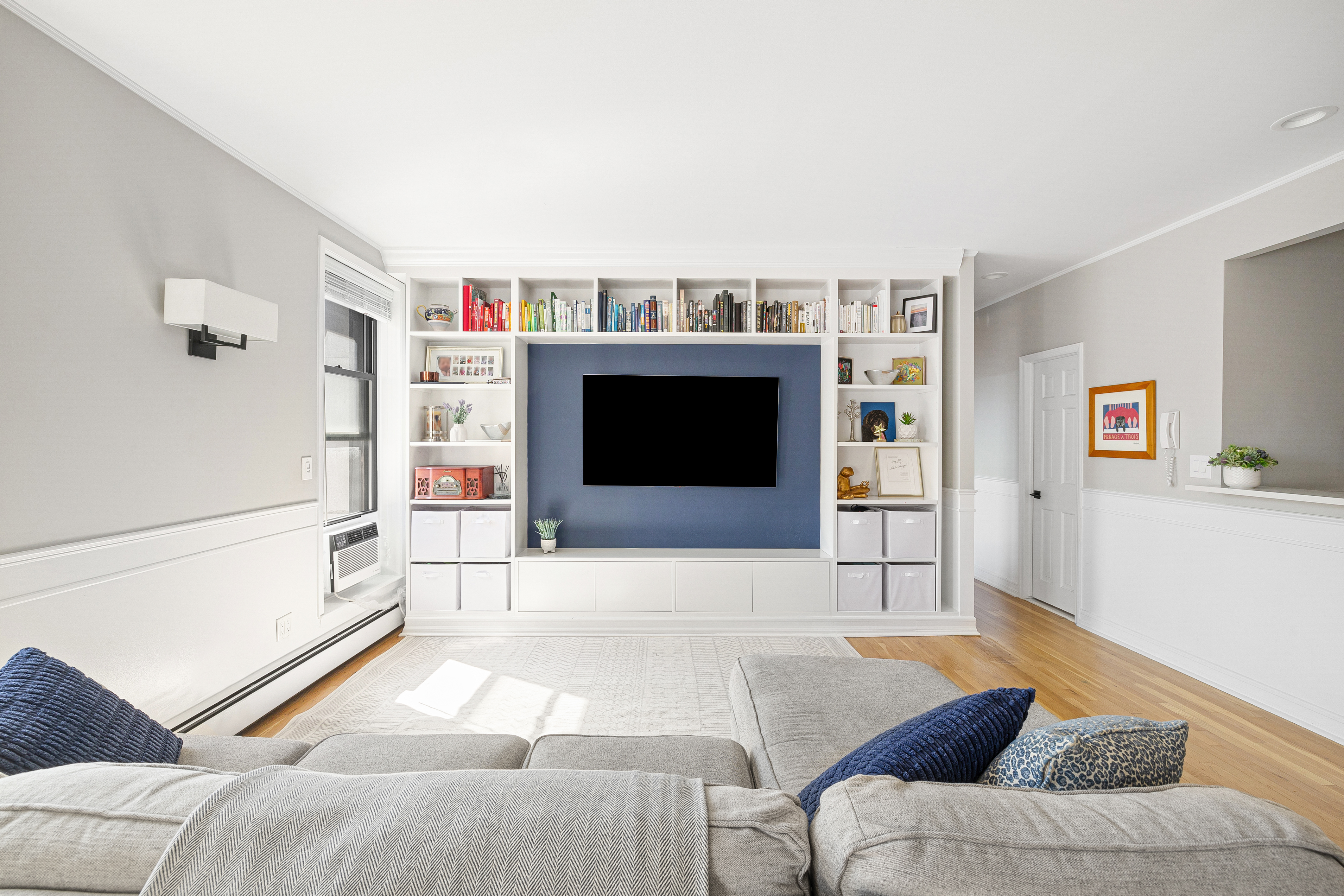 315 West 99th Street, Unit PHA Manhattan, NY 10025 - Photo 5 of 17 a living room with furniture and a flat screen tv