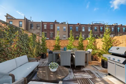 a view of a terrace with furniture and a potted plant