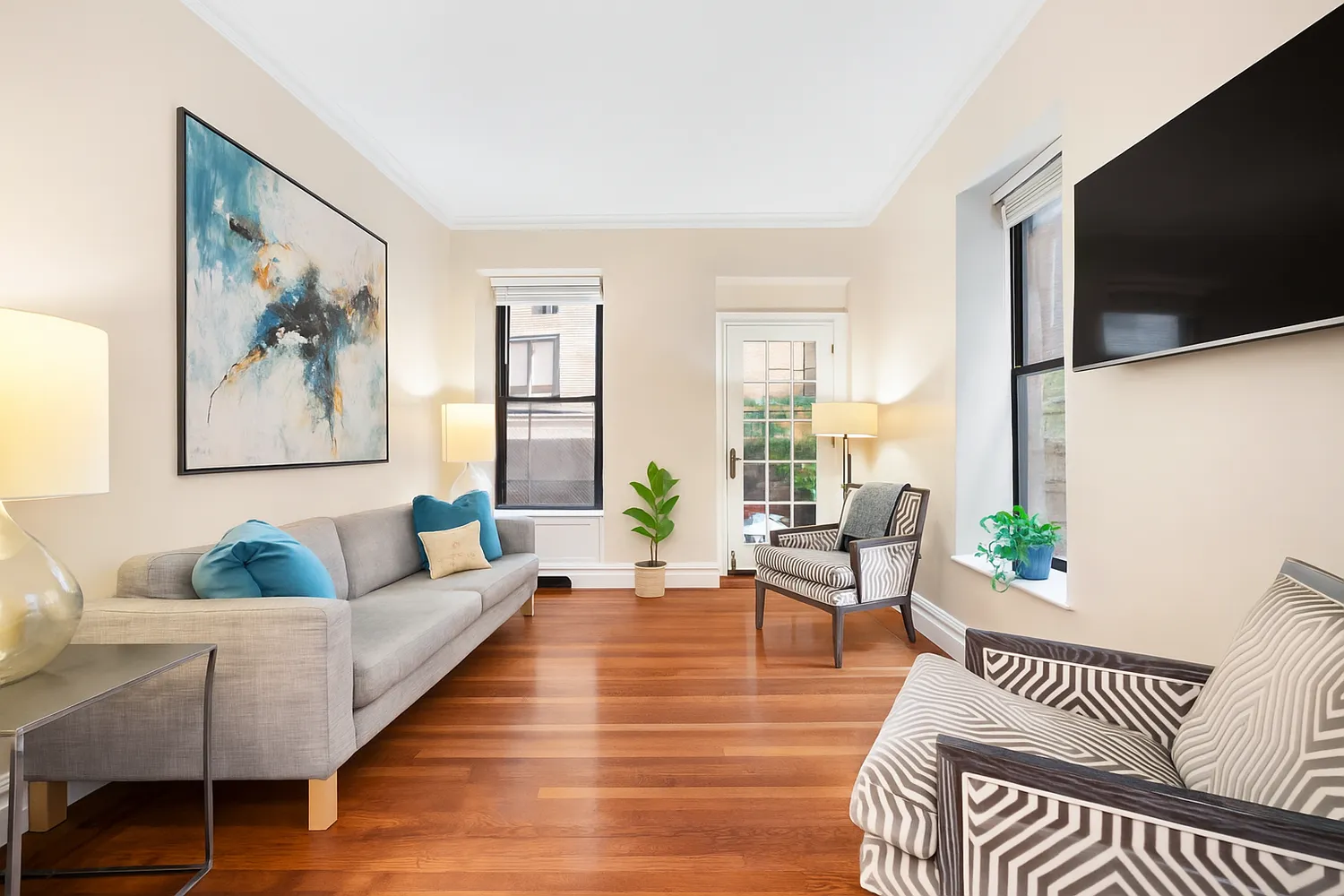 a living room with furniture and a flat screen tv