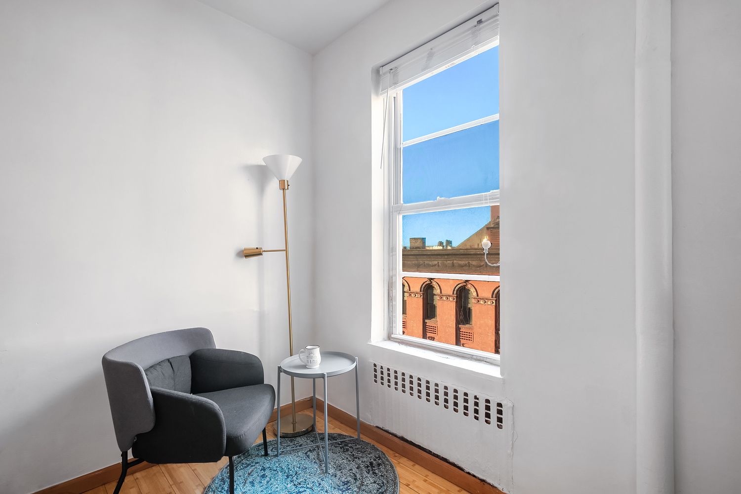 304 West 10th Street, Unit 4B Manhattan, NY 10014 - Photo 3 of 10 a living room with furniture and a window