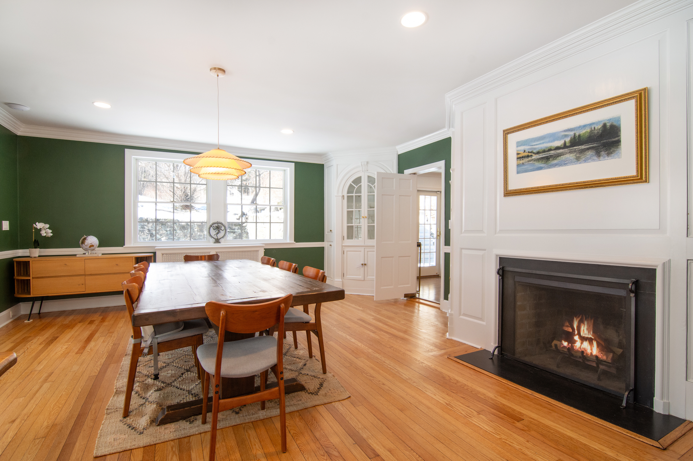 41 Harris Road Katonah, NY 10536 - Photo 9 of 48 a kitchen with a table chairs and a fireplace