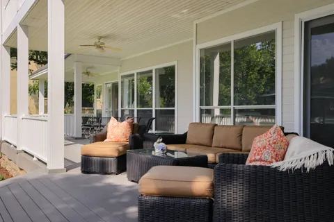 a outdoor living space with furniture and a large window