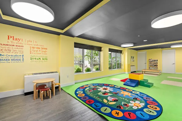 a bedroom with furniture and a large window