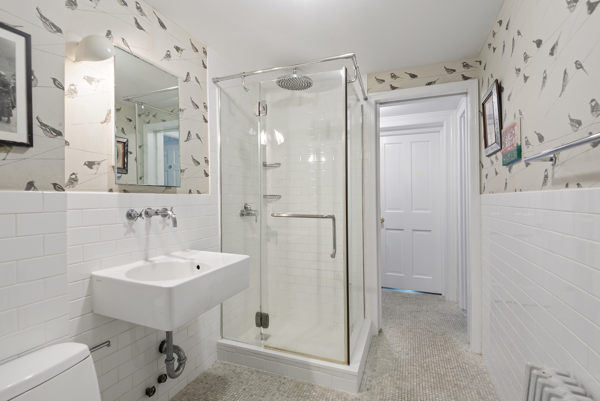 399 Union Street, Unit 1 Brooklyn, NY 11231 - Photo 6 of 10 a bathroom with a sink a toilet and shower