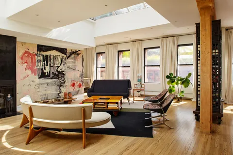 a work room with furniture and wooden floor