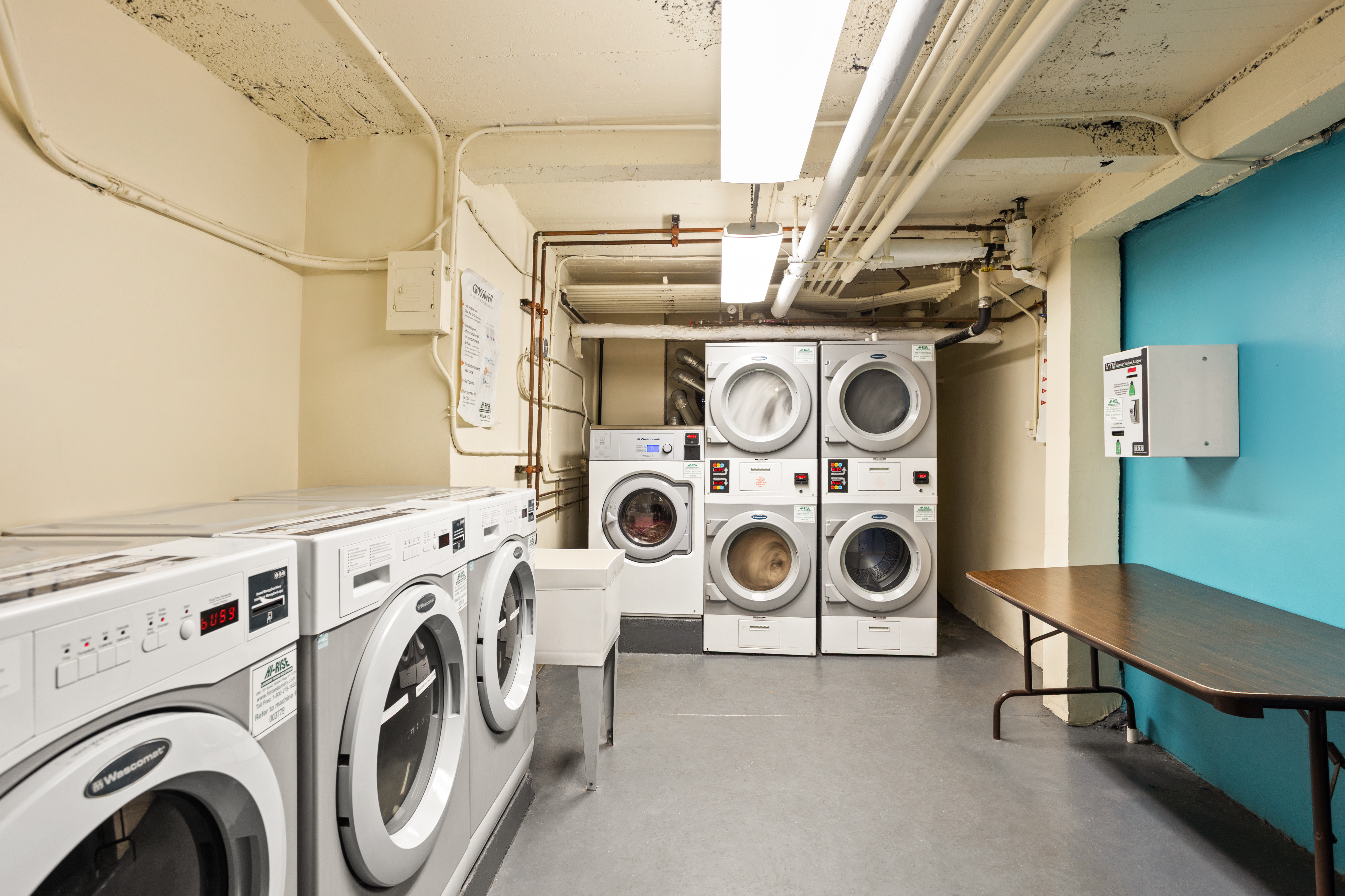 35-30 73rd Street Queens, NY 11372 - Photo 8 of 11 a utility room with dryer and washer
