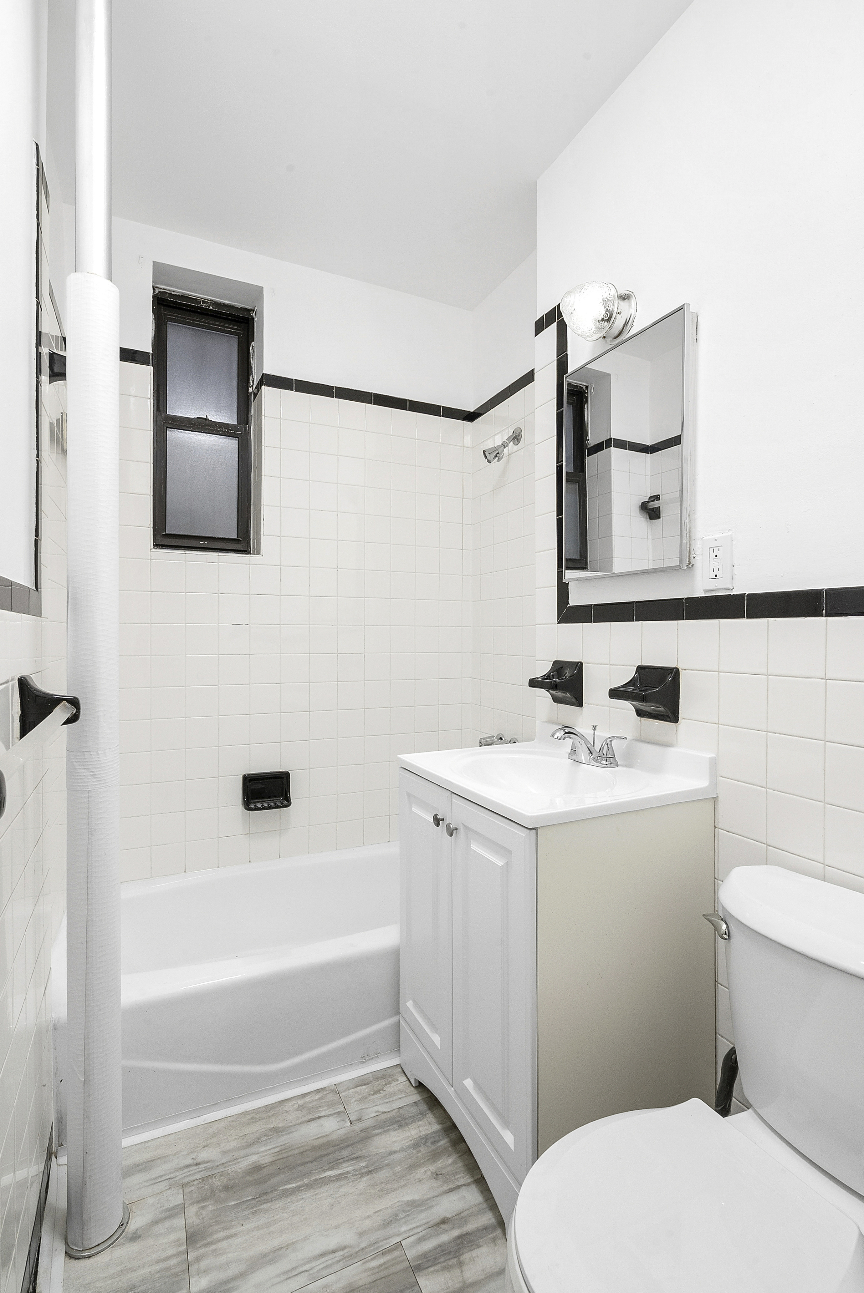 773 Eastern Parkway, Unit 1A Brooklyn, NY 11213 - Photo 9 of 11 a bathroom with a sink a toilet and bathtub