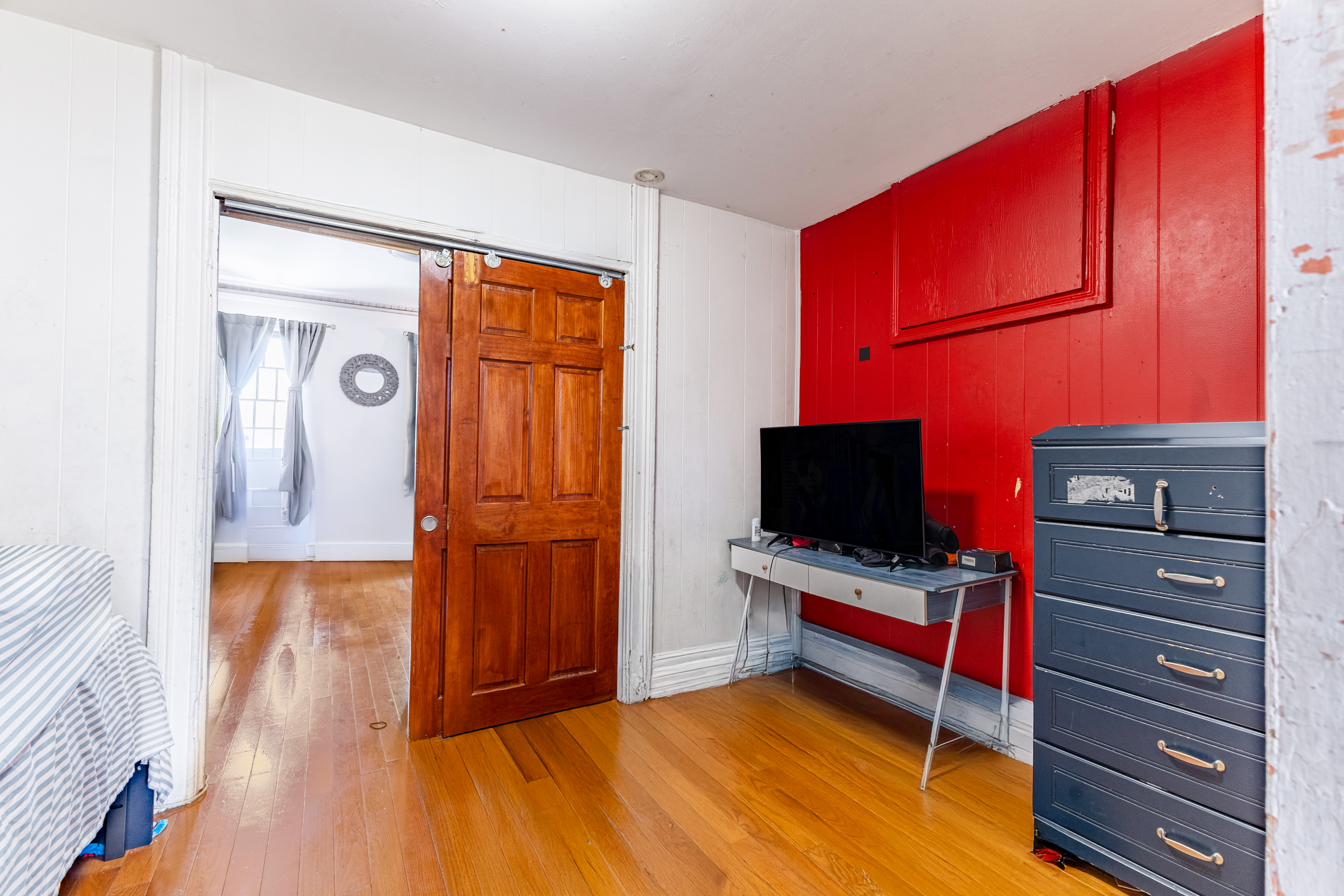 52 Himrod Street Brooklyn, NY 11221 - Photo 13 of 16 a living room with furniture and flat screen tv