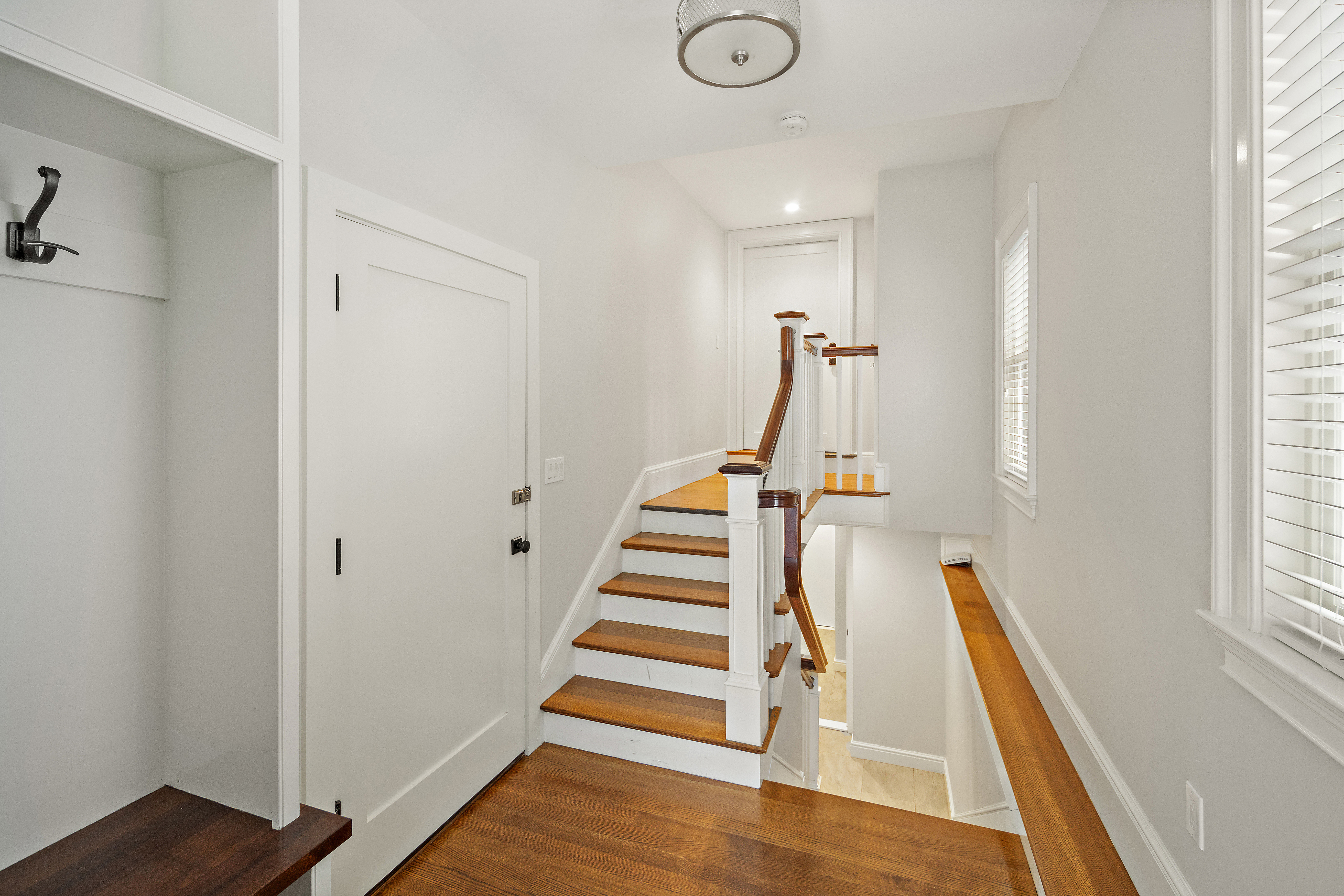 35 Willard Street Cambridge, MA 02138 - Photo 33 of 36 a view of a hallway with wooden floor and staircase