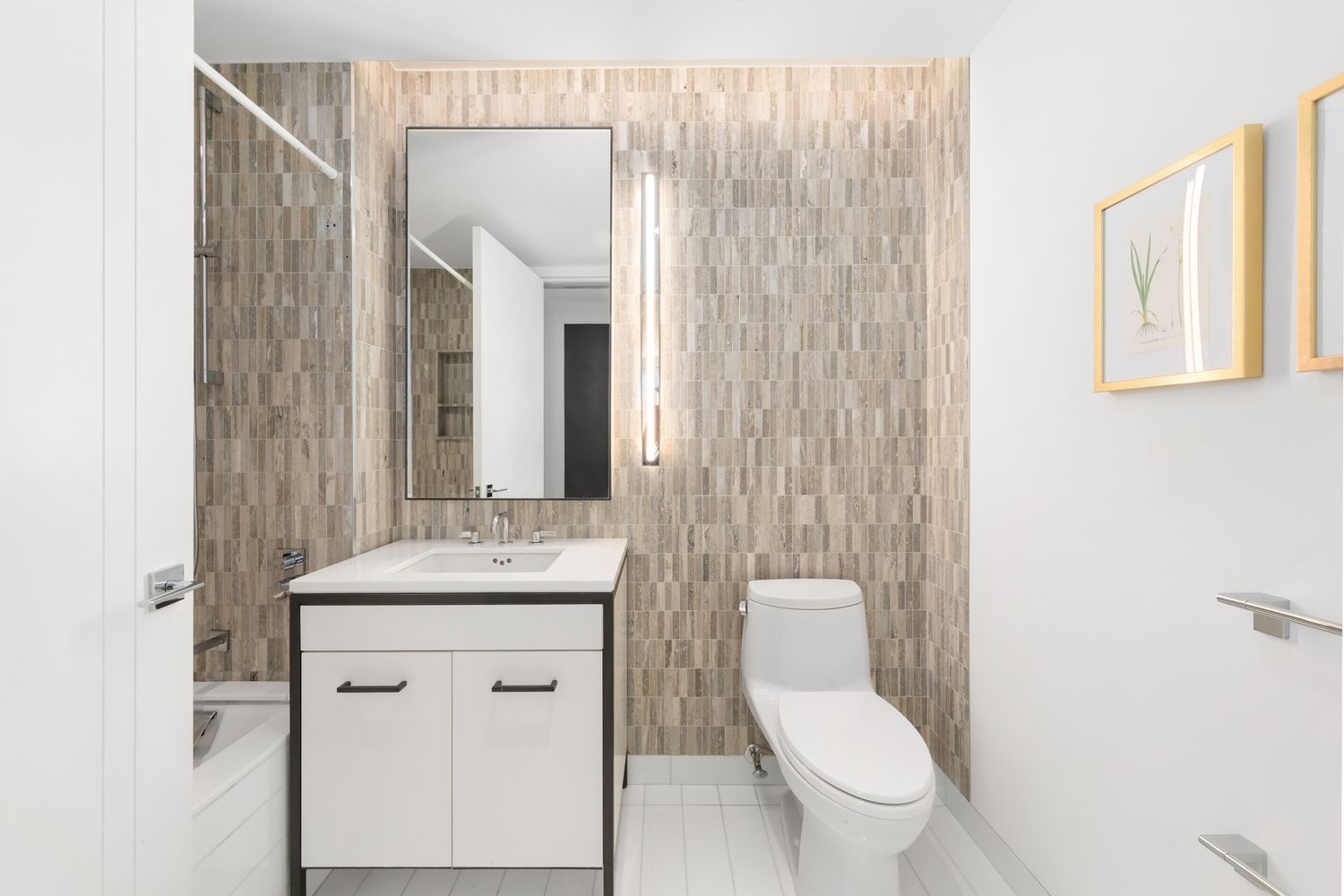 70 Charlton Street, Unit 19D Manhattan, NY 10014 - Photo 7 of 14 a bathroom with a toilet a sink and mirror