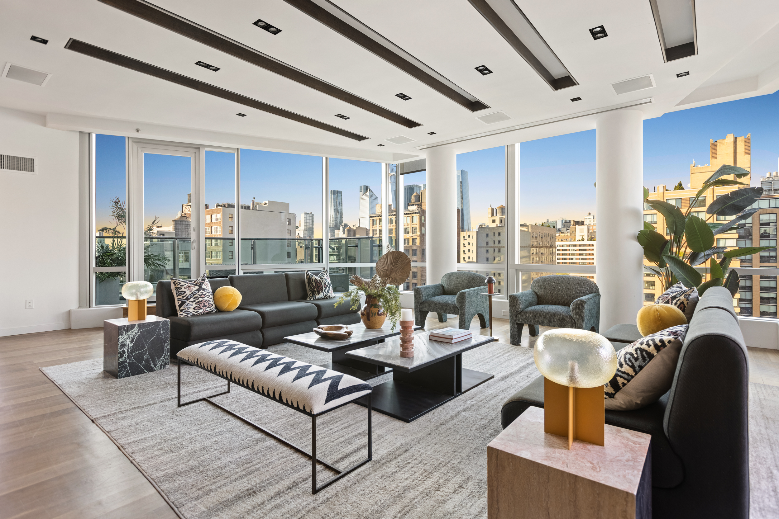 166 West 18th Street, Unit PH11 Manhattan, NY 10011 - Photo 3 of 16 a living room with furniture and a large window