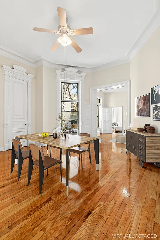 1102 Dean Street, Unit 4 Brooklyn, NY 11216 - Photo 4 of 12 a view of a dining room with furniture and wooden floor