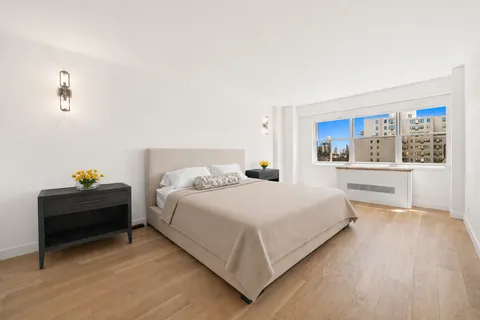 a bedroom with a bed and a cabinets