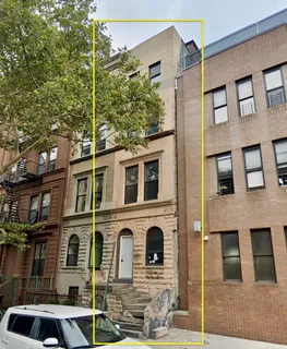 a front view of a building with balcony