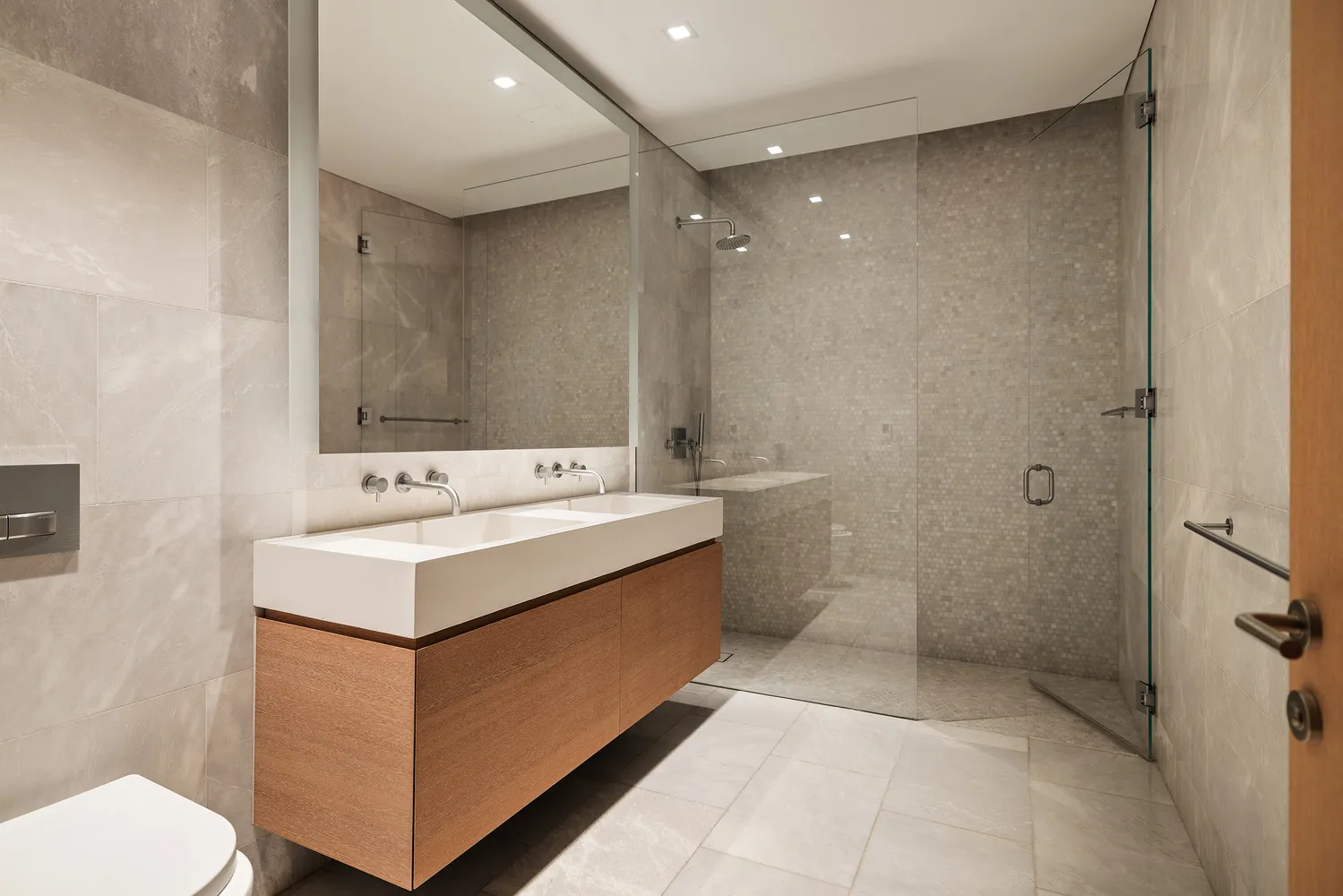 a bathroom with a sink toilet and shower