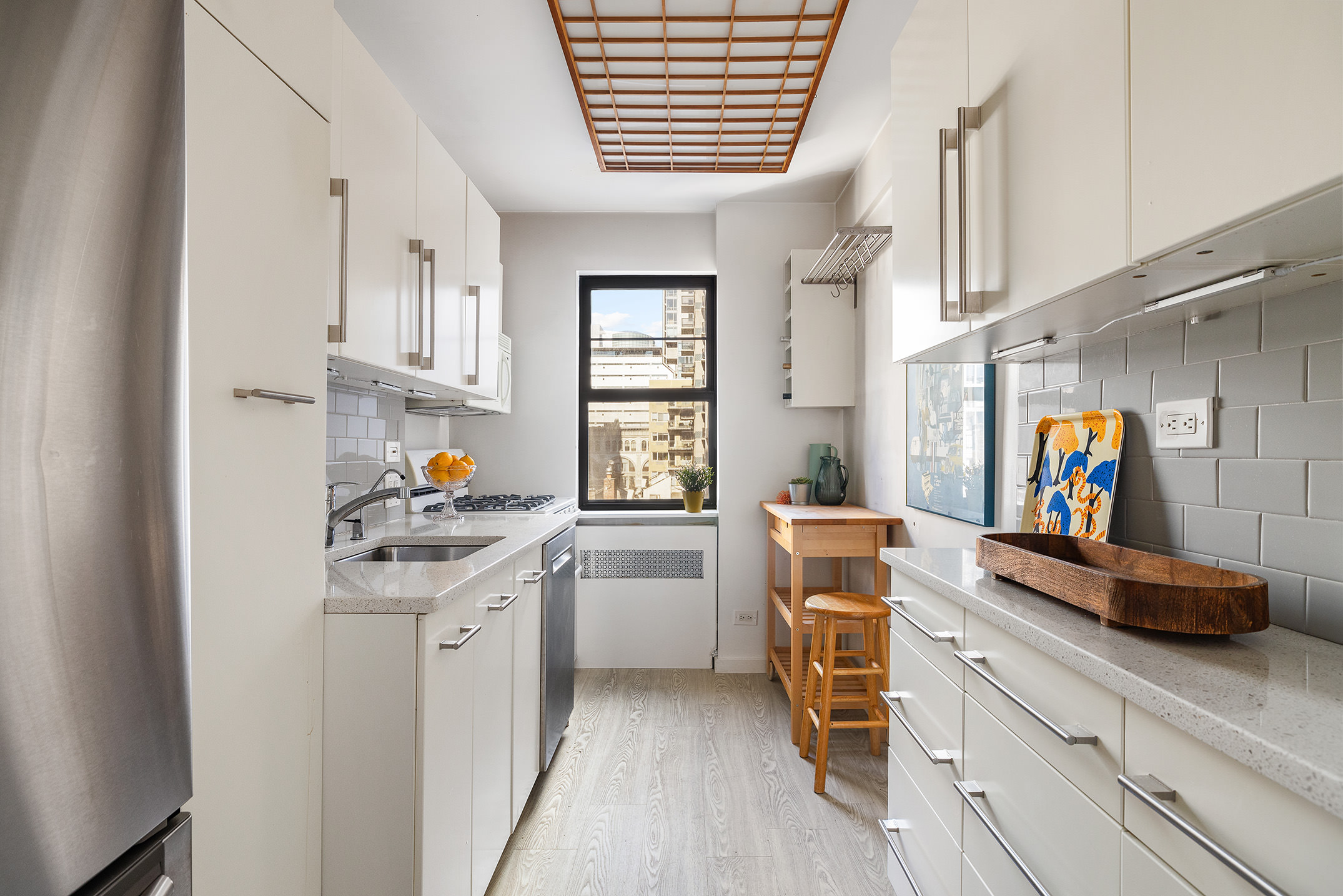 39 Gramercy Park North, Unit 9A Manhattan, NY 10010 - Photo 7 of 10 a kitchen with stainless steel appliances a stove a sink and a refrigerator