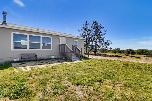 a view of a yard with an ocean view