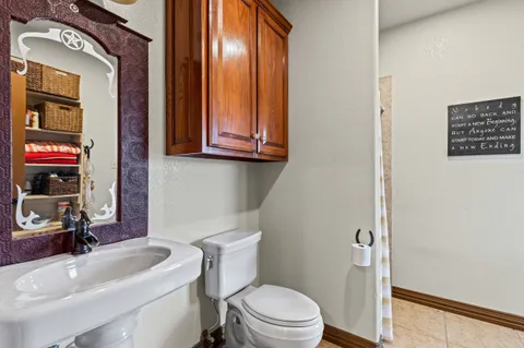 a kitchen with granite countertop cabinets and window