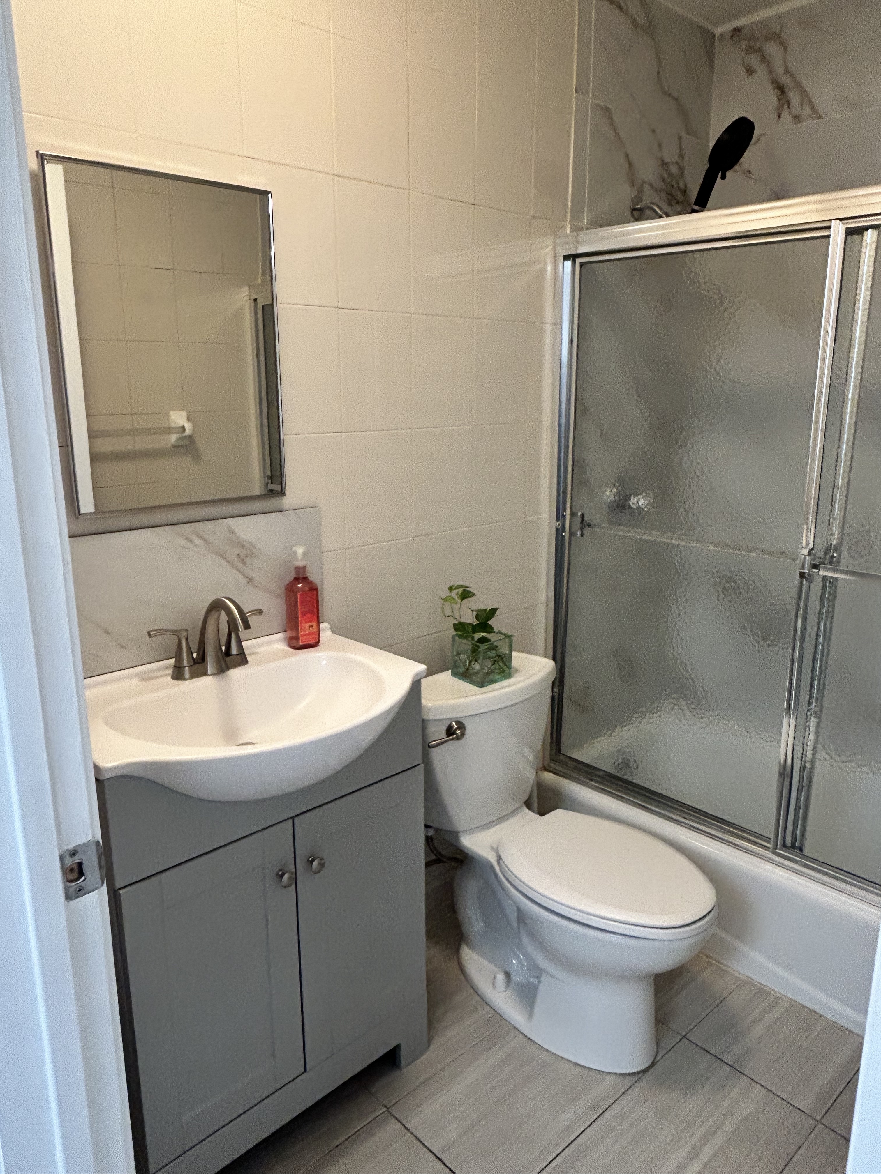 47 West 37th Street, Unit 4 Manhattan, NY 10018 - Photo 4 of 7 a bathroom with a sink toilet and shower