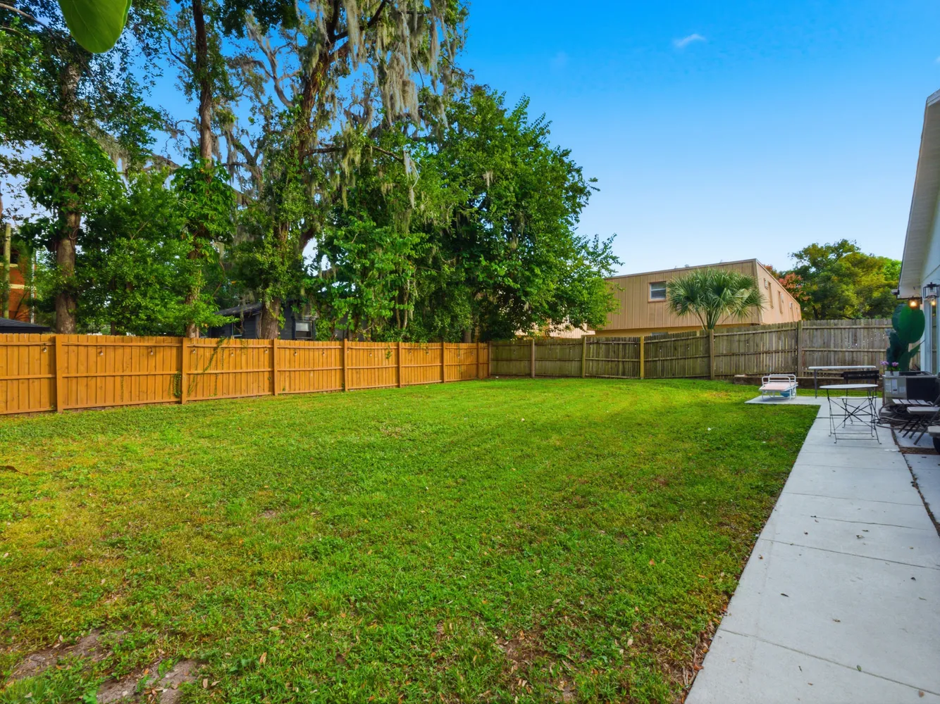 a view of yard with grass and a trees