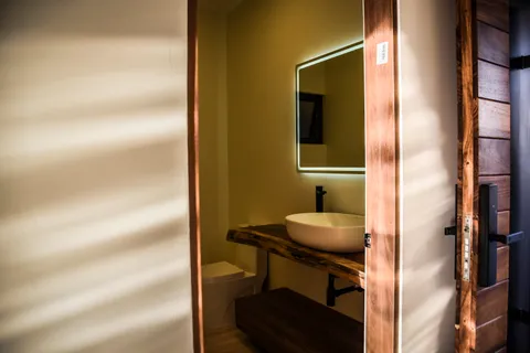 a bathroom with a shower and a sink