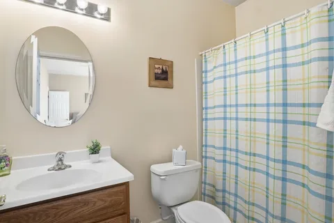 a living room with furniture a white bed and a couch