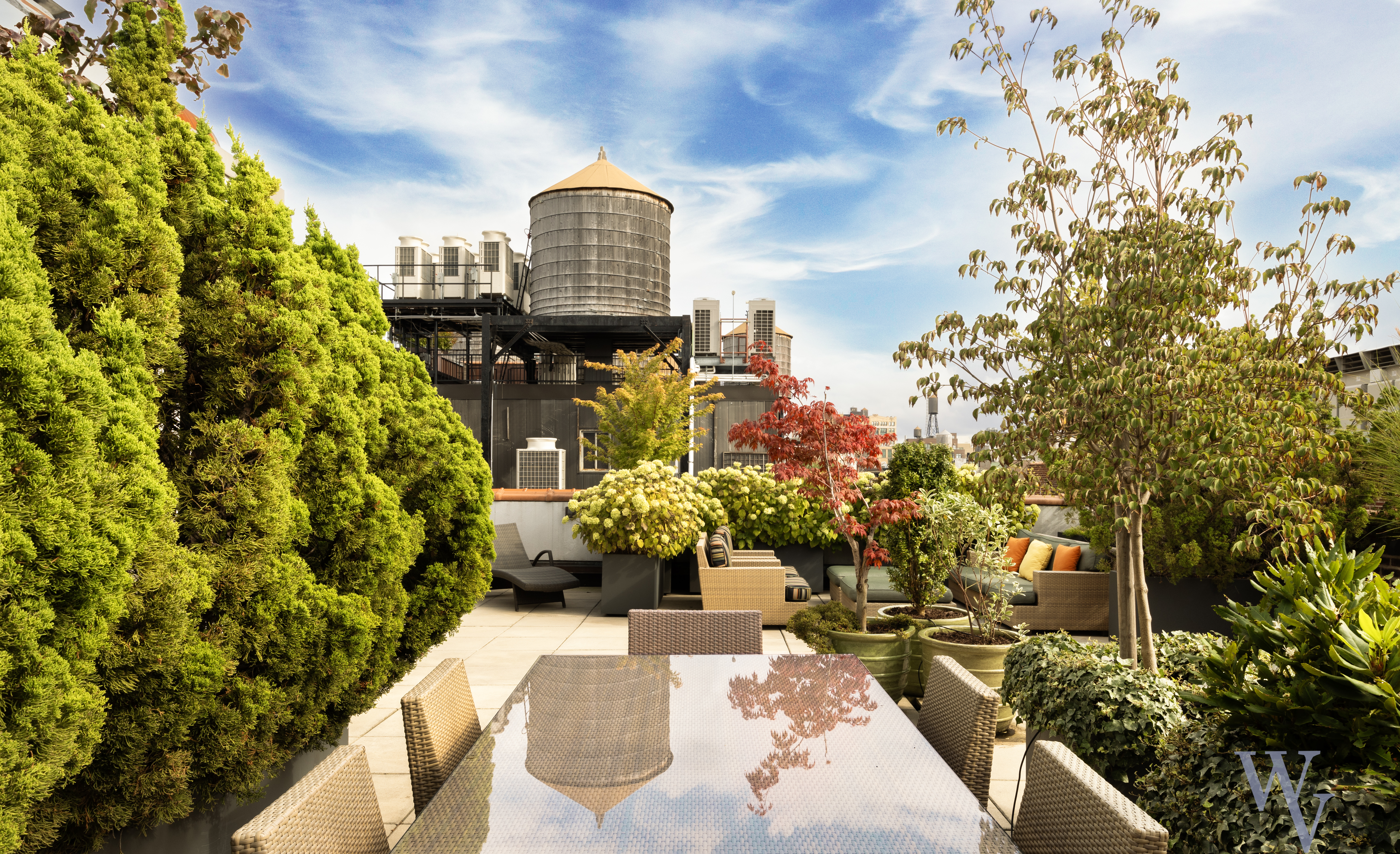 140 West 22nd Street, Unit 2B Manhattan, NY 10011 - Photo 11 of 12 a view of a patio with table and chairs and potted plants