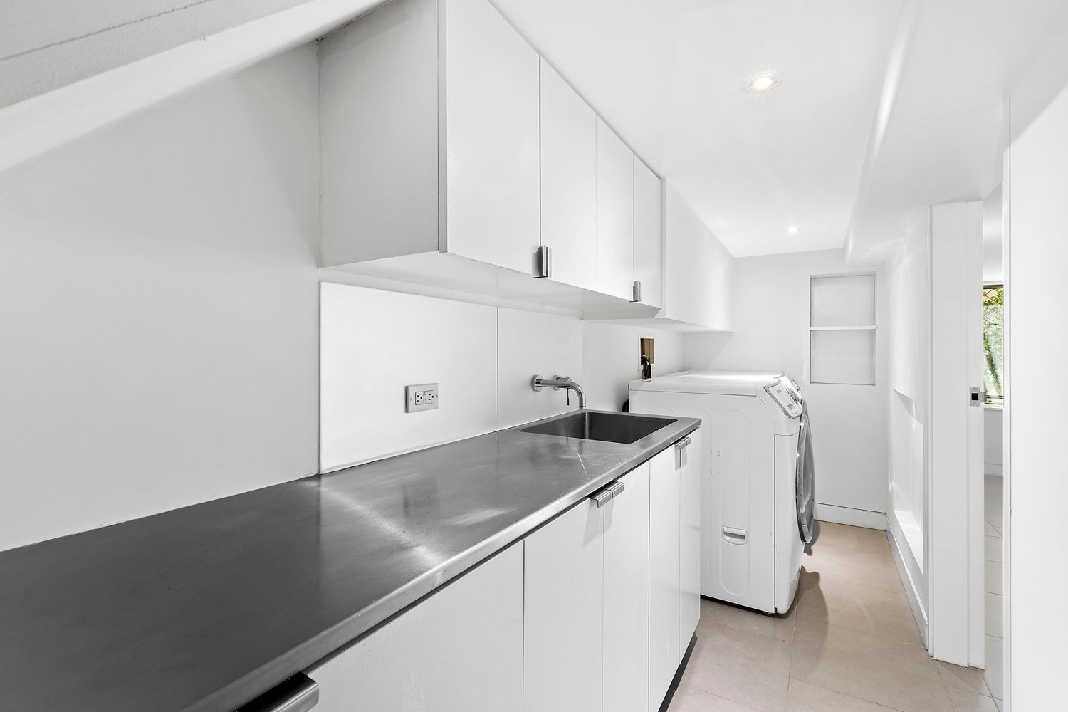 64 Clifton Place, Unit PARLOR Brooklyn, NY 11238 - Photo 16 of 17 a kitchen with stainless steel appliances granite countertop a sink a stove and a refrigerator