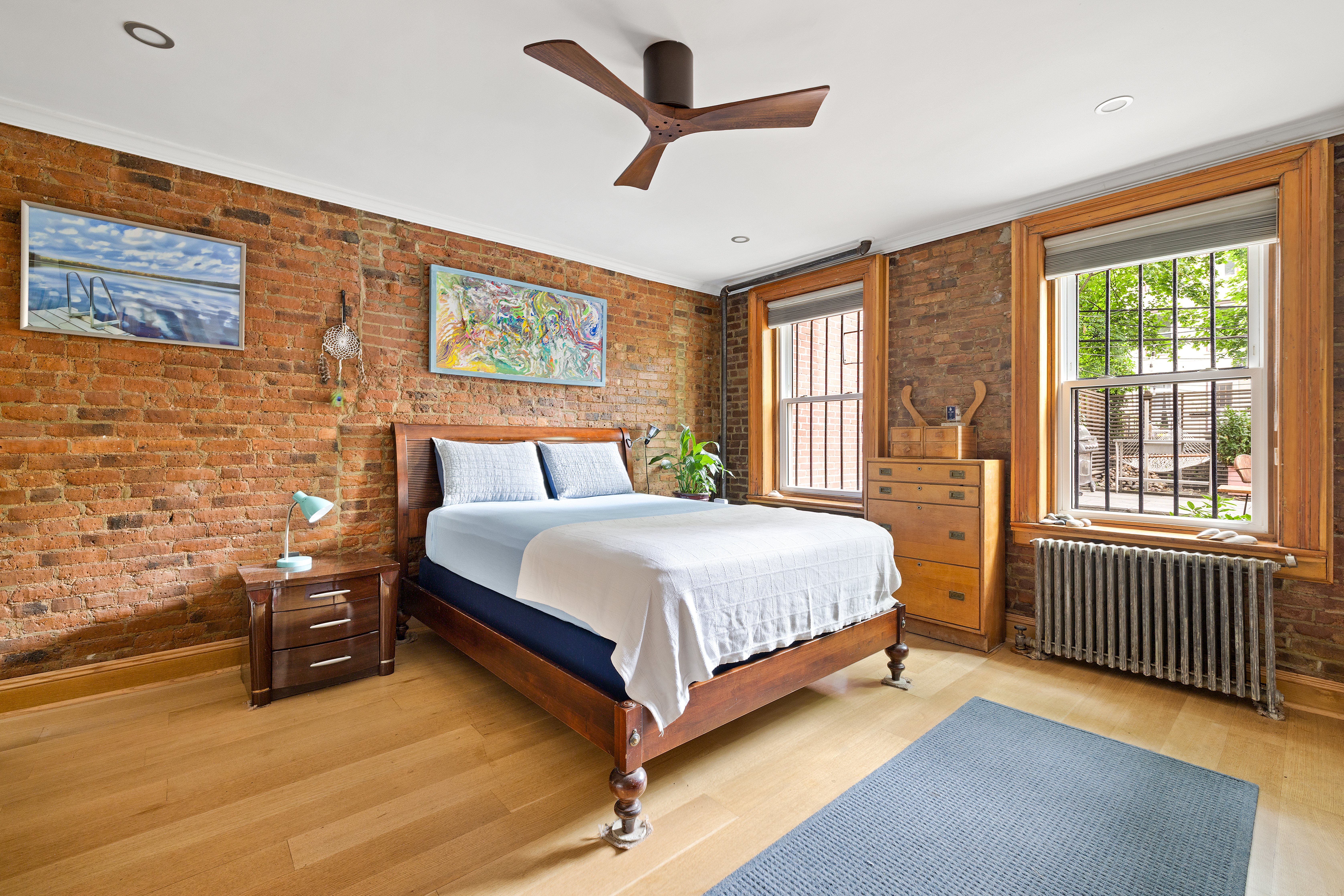 445 Greene Avenue, Unit 1 Brooklyn, NY 11216 - Photo 3 of 12 a bedroom with a bed and a large window