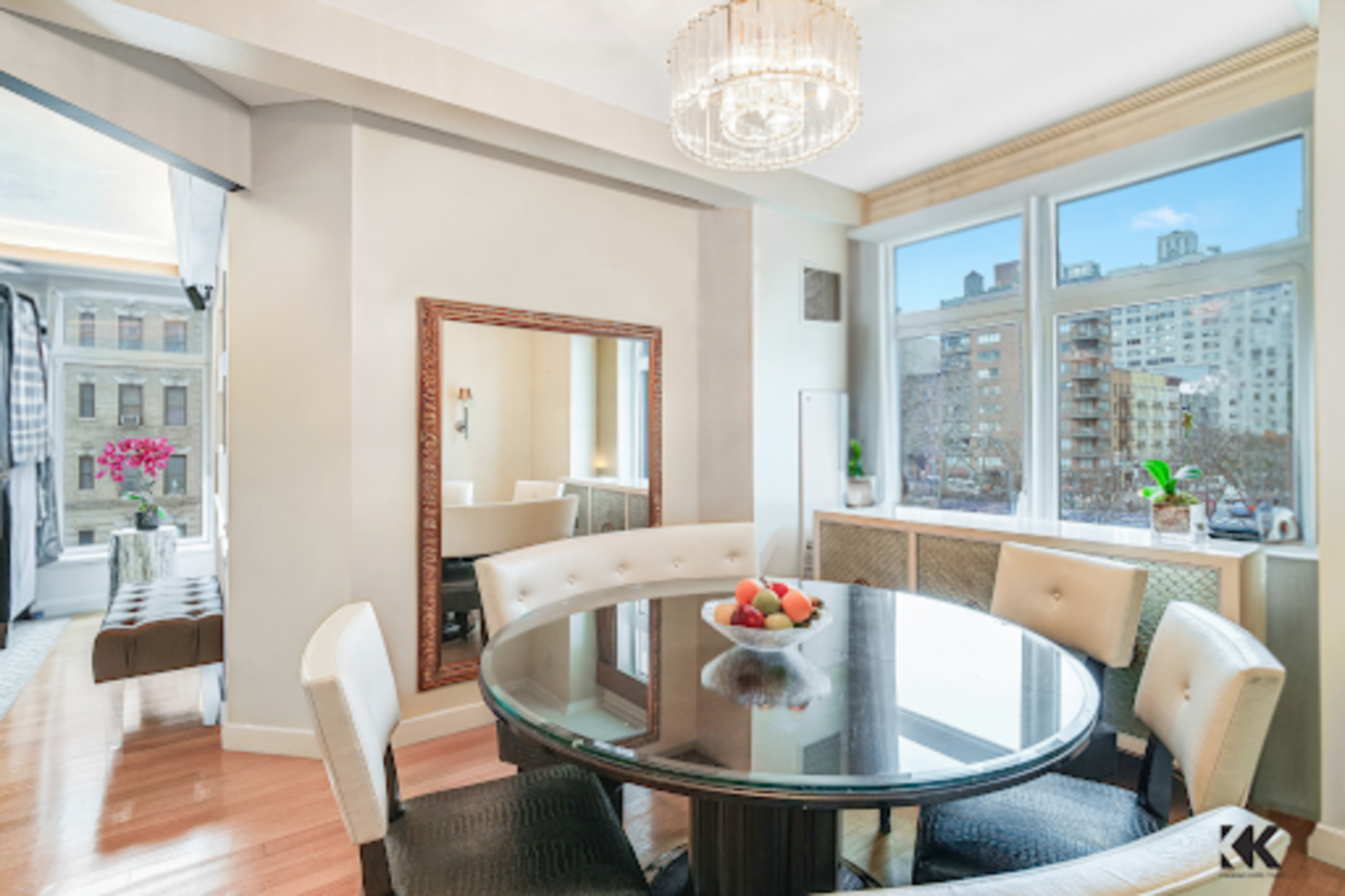 400 East 67th Street, Unit 3CD Manhattan, NY 10065 - Photo 5 of 28 a dining room with furniture a chandelier and wooden floor