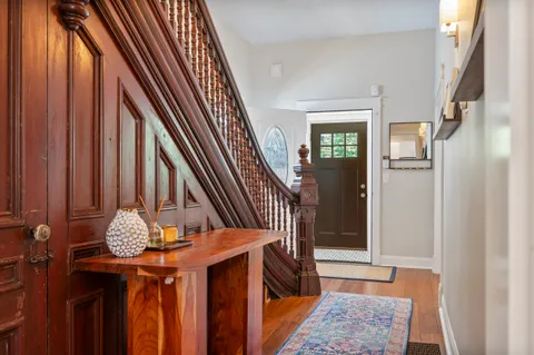 a view of stairs and with wooden floor