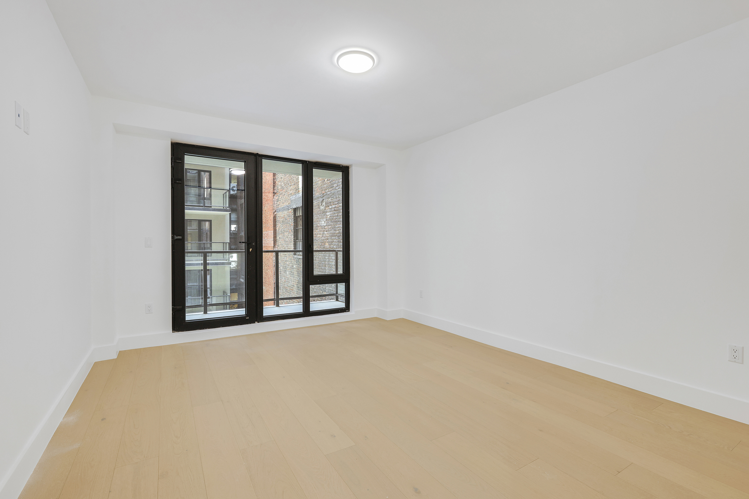 21 West 17th Street, Unit 4 Manhattan, NY 10011 - Photo 8 of 11 view of an empty room with a window